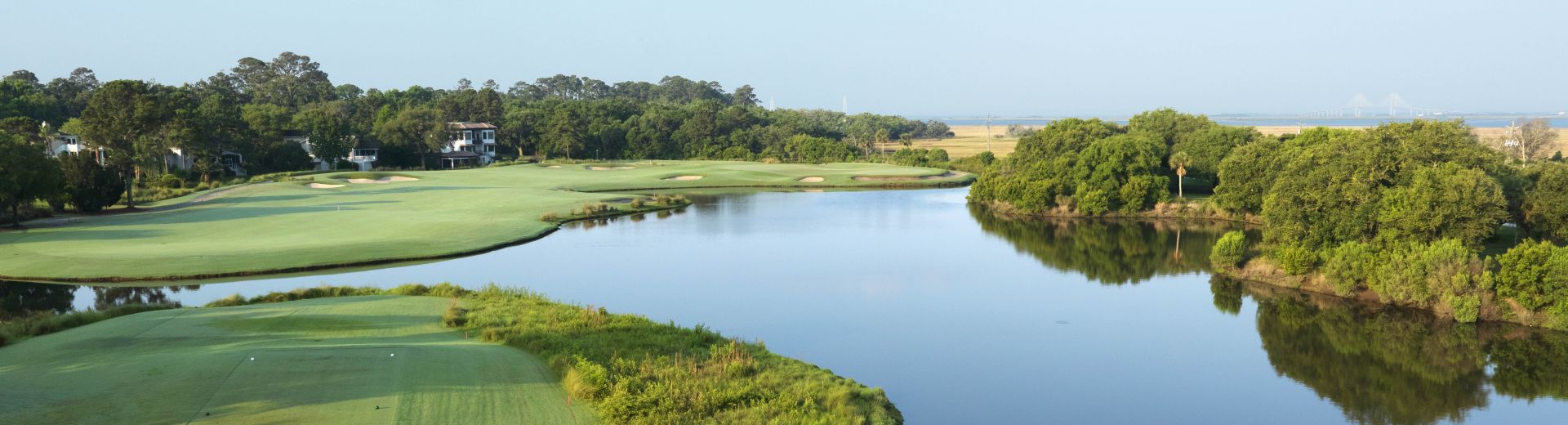 A tee from the Sea Island Retreat golf course overlooking pristine and calm waters